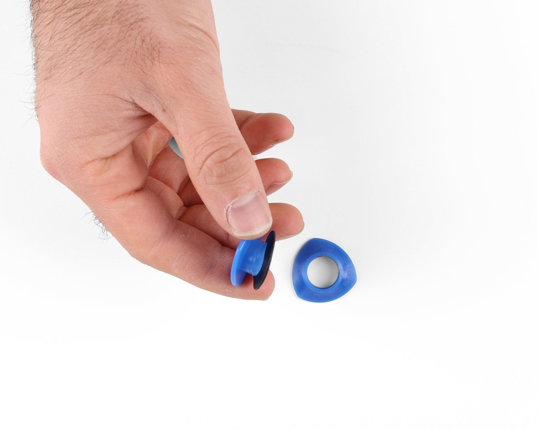 hands holding the grommet with rubber washer on